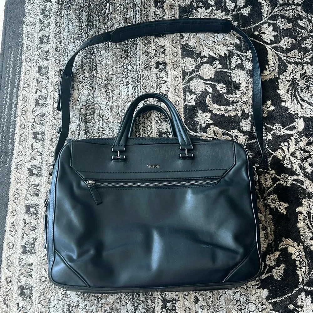 Tumi genuine leather black briefcase with removable strap and silver hardware